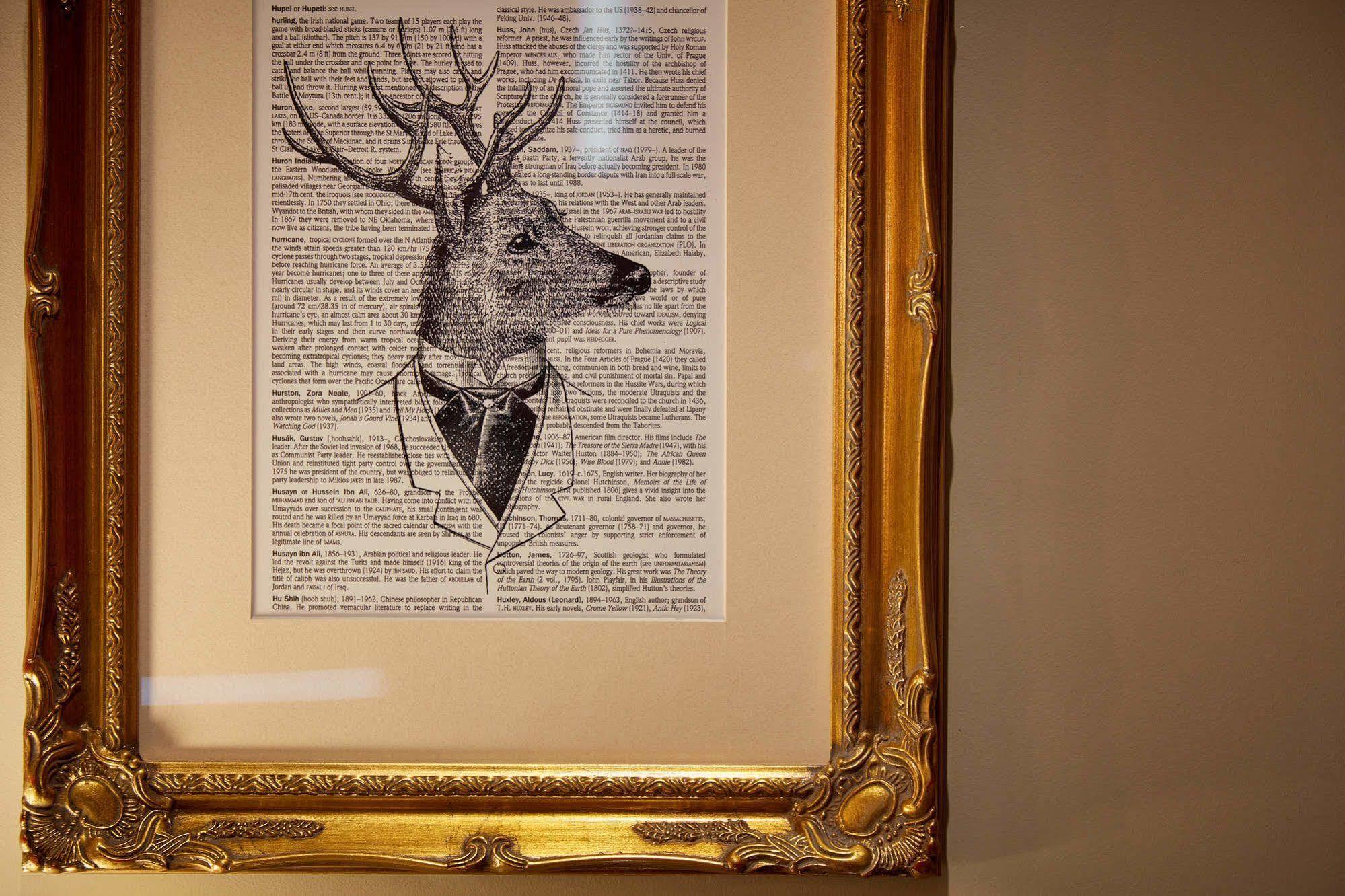 Oddfellows On The Park تشيدل المظهر الخارجي الصورة A framed print of a deer head with a bow tie